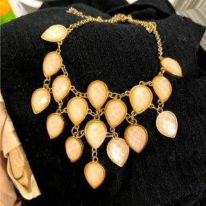 Peach and gold colored necklace